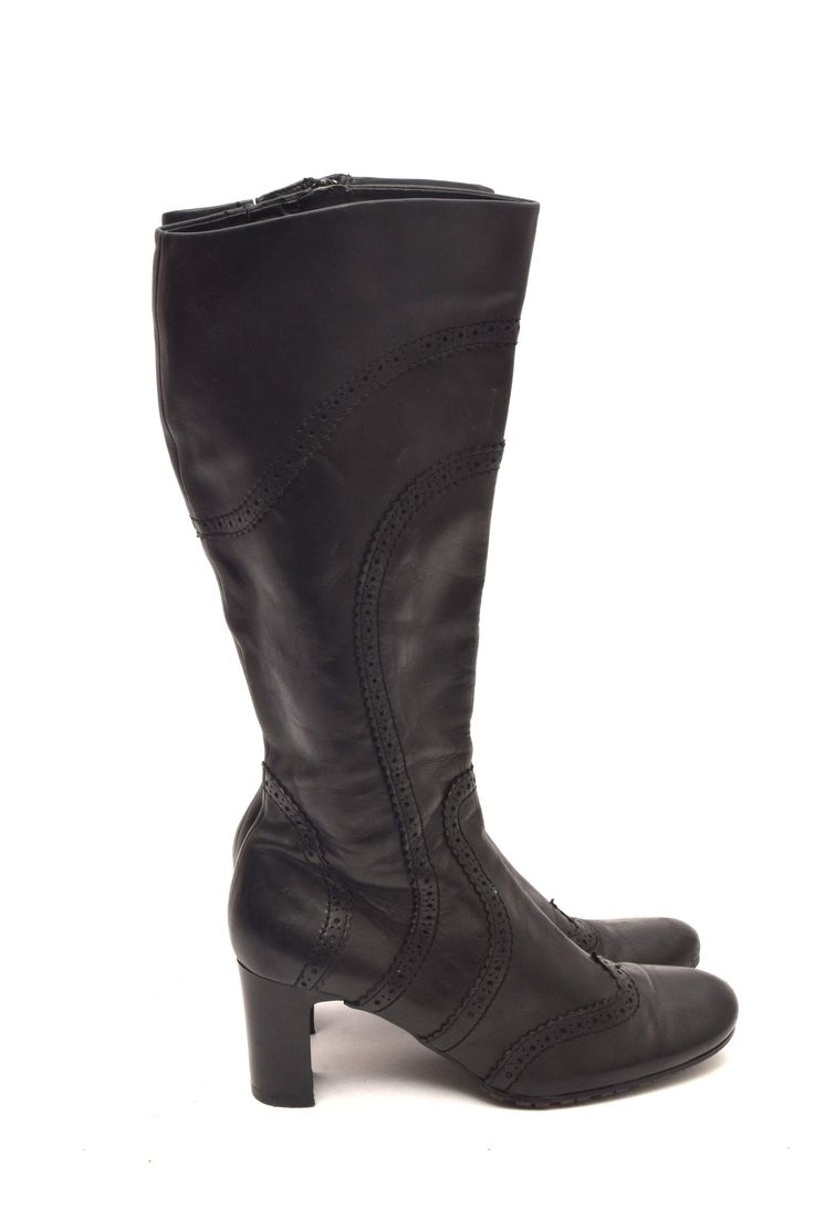 If you are looking for a pair of boots that are stylish, comfortable, and versatile, look no further than these vintage 90s pebbled leather tall boots. These boots are made of genuine leather that has a pebbled texture, giving them a unique and rugged appearance. The chunky heel is about 2.5 inches (6 cm) high, providing stability and support for your feet. The rounded toe shape is flattering and comfortable, and the shaft is about 13 inches (34 cm) high, reaching just below your knees. These bo Retro Leather Winter Boots, Vintage Faux Leather Winter Boots, Vintage Winter Boots In Faux Leather, Vintage Faux Leather Boots For Fall, Retro Leather Boots For Fall, Vintage Faux Leather Boots With Round Toe, Vintage Faux Leather Round Toe Boots, Retro Medium Width Boots For Fall, Retro Medium Width High Heel Boots