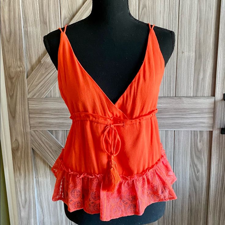 Nwt Bright Orange Colored Camisole Crisscross Back Adjustable Straps Lace Bottom Trim Very Cute Blouse Size Small Spring V-neck Tank Top With Straps, Spring Vacation Red Camisole, Spring Red Camisole For Beach, V-neck Camisole With Straps For Day Out, Vacation V-neck Tank Top With Straps, V-neck Tank Top With Straps For Vacation, Summer V-neck Tops With Straps, V-neck Tank Top With Straps For Day Out, Beach V-neck Cotton Camisole