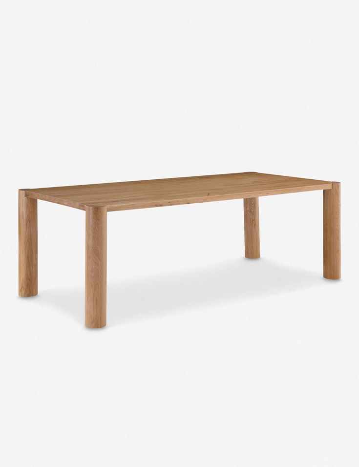 a wooden table sitting on top of a white floor