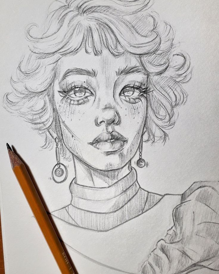 a pencil drawing of a woman with freckles on her face