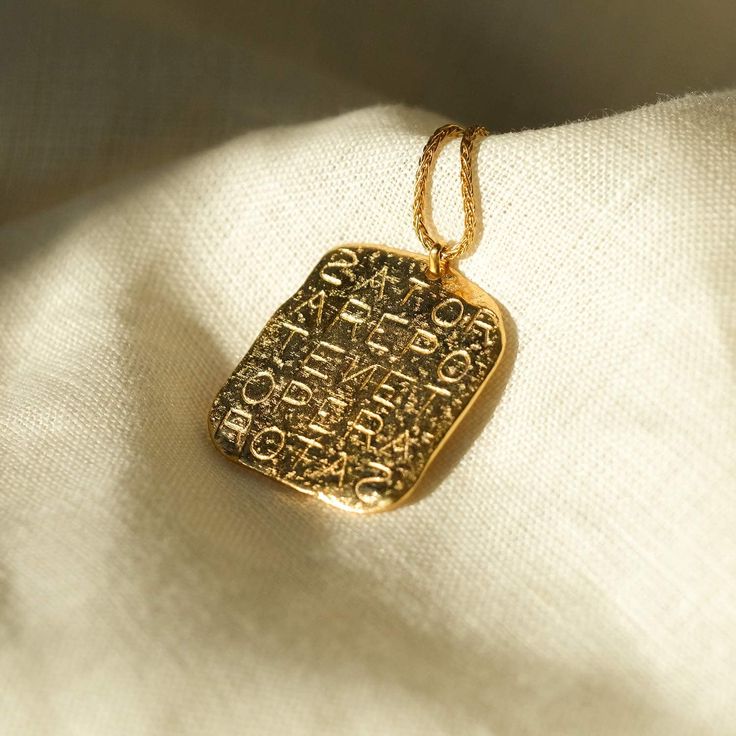 Magic Sator Square Gold Talisman Necklace - COMMON ERA Ancient Gold Jewelry For Ceremonial Occasion, Ancient Style Gold Jewelry For Ceremonial Occasion, Ancient Style Gold Ceremonial Jewelry, Gold Rectangular Pendant Necklace Collectible, Gold Rectangular Pendant Necklace For Collectors, Engraved Bronze 14k Gold Necklaces, Ancient Style Engraved Yellow Gold Necklaces, Gold Ancient Style Engraved Necklace, Ancient Etched Gold Jewelry