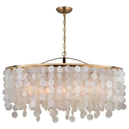 a chandelier with white beads hanging from the ceiling