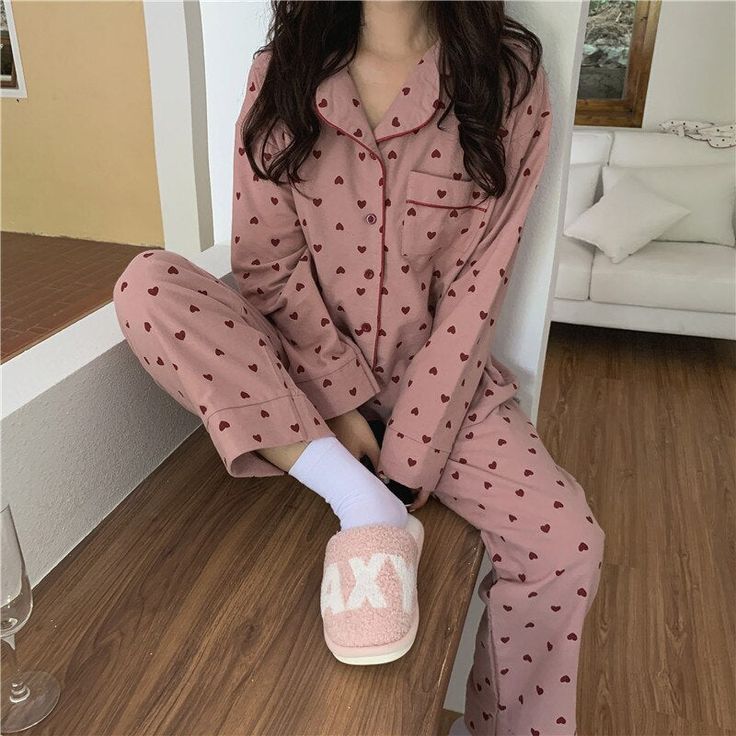 This super cute women's pajamas set comes with an allover heart print perfect for adding a stylish yet cozy touch to your loungewear. The button-up top design features a full-length sleeve, turn-down collar, and chest pocket for added detail. The cotton fabric and elastic waist ensures complete comfort while lounging around the home. The perfect pajamas for stylish comfort. The pajamas are 100% cotton, and run slightly smaller so size up if you want extra room... Spring Sleepwear, Korean Pajamas, Womens Lounge Set, Summer Party Outfit, Pajama Fashion, Cute Sleepwear, Cute Pajama Sets, Cotton Pajama Sets, Cute Pajamas