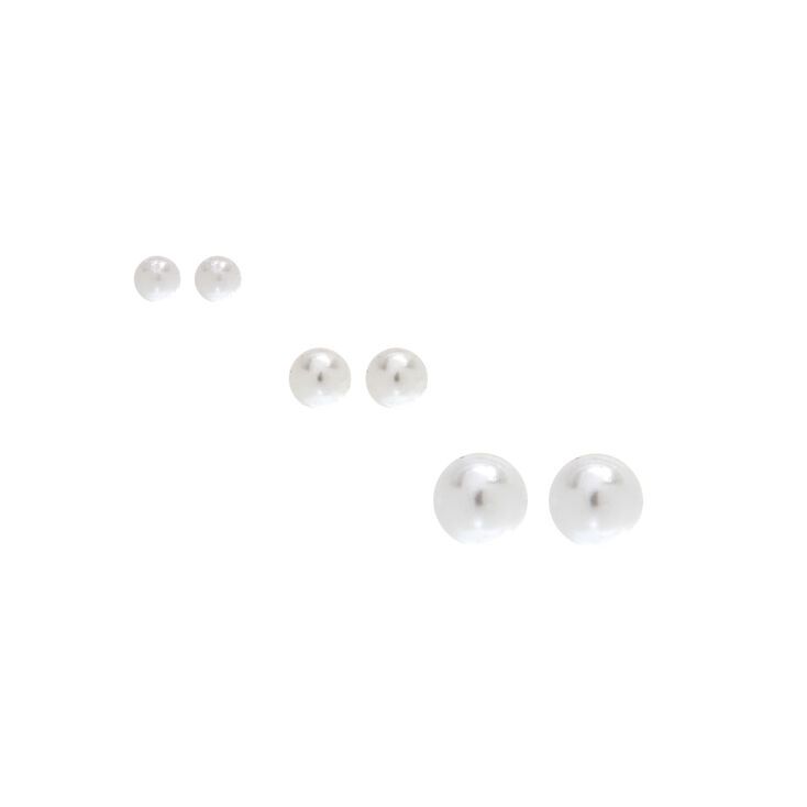 Jazz up your look with a touch of classy sterling silver earrings! This set of three includes elegant ivory faux pearls in three different sizes ranging from small, medium, and large. Finish: Silver-tone Closure: Post back Pack Size: 3 Material: Sterling silver - Claire's Sterling Silver Graduated Pearl Stud Earrings - Ivory, 3 Pack Sensitive Ears Earrings, Ivory Earrings, Word Bracelet, Jewelry Words, Fashionable Jewelry, Ivory Pearl, Pearl Stud Earrings, Pearl Studs, Fashion Accessories Jewelry