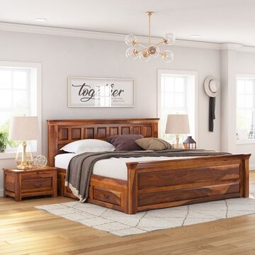 a bed room with a neatly made bed and two night stands