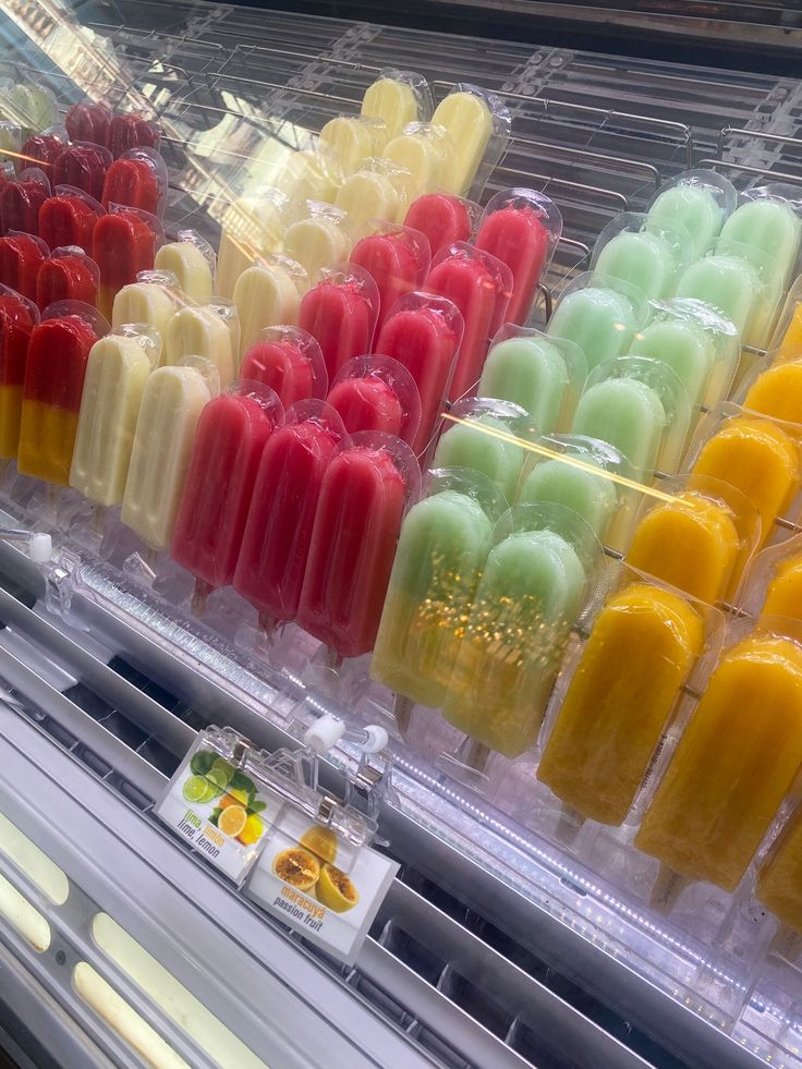 many different colored pops are on display in a store