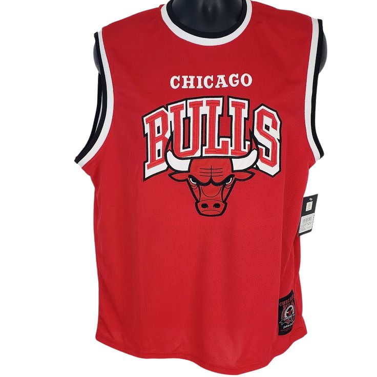 Look sharp and stay cool in this eye-catching red sleeveless Chicago Bulls jersey. It's got a bold embroidered logo, and black and white trim around the armholes and neckline. The Chicago Bulls Eastern Conference jock tag is on bottom And of course, it's NBA approved and ready to show off your fandom! Who says looking good can't be easy? Color: Red Material: Polyester Care: Machine wash, cold Fitted Sleeveless Sports T-shirt, Sporty Tops With Embroidered Team Logo, Collegiate Black Sleeveless Top, Collegiate Sleeveless Top For Streetwear, Collegiate Fitted Sleeveless Top, Collegiate Sleeveless Cotton Top, Collegiate Sleeveless Fitted Top, Sleeveless Tops For Sports Events With Team Spirit, Team Spirit Red Sleeveless Tops