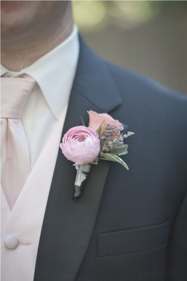 a man in a tuxedo with a boutonniere on his lapel