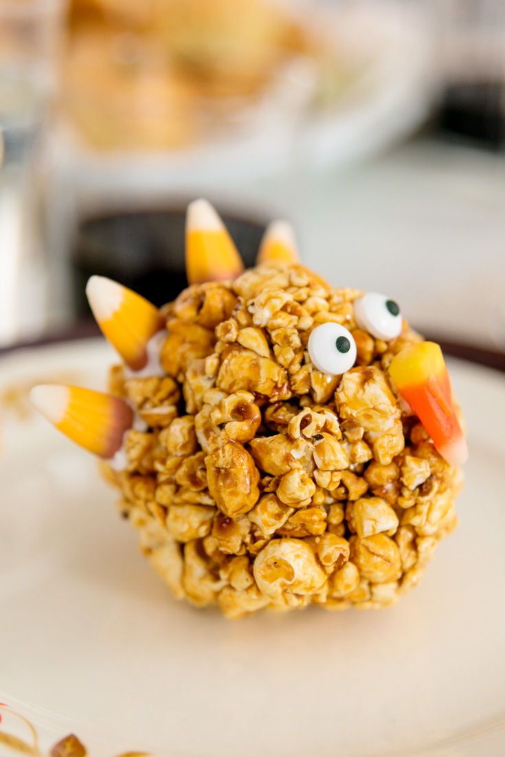 a close up of a plate of food with candy cornflakes and eyes on it