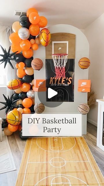 an indoor basketball court decorated with orange, black and white balloons that read diy basketball party