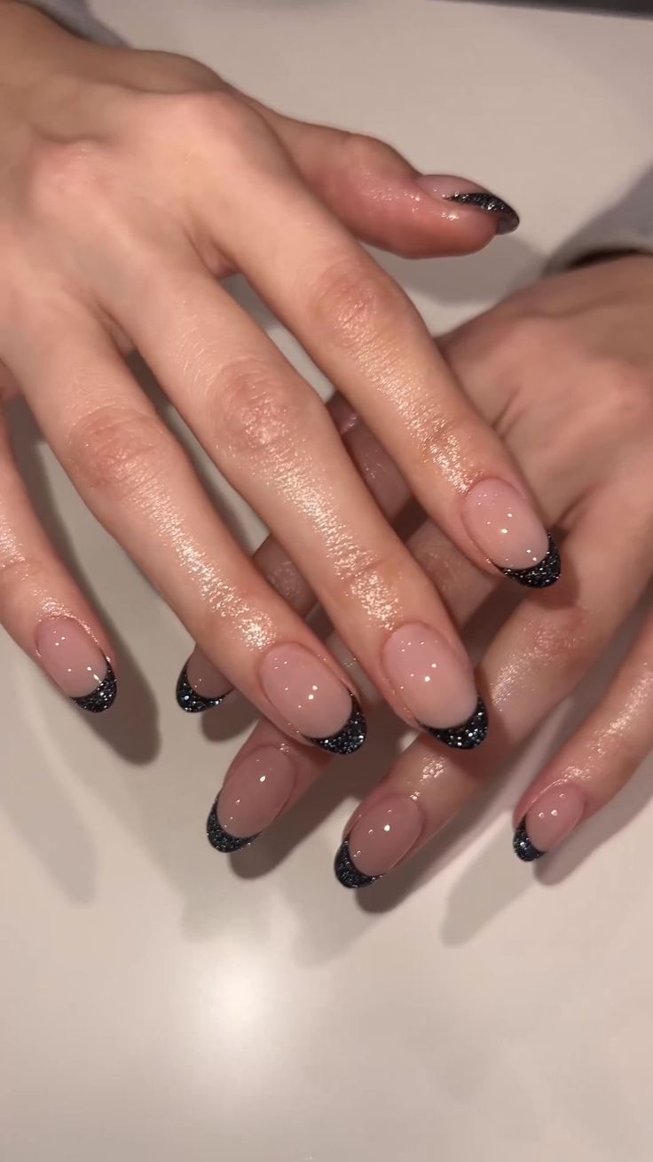 30 Best March Nails to Inspire You Short Oval Nails Designs Black, Black Hoco Nails Almond, Sparkly Black French Tip Nails Almond, Nail Inspo For Black Prom Dress, Black Sparkle Tip Nails, Black Reflective Nails, Black Sparkle Acrylic Nails, Black Chrome French Tip Nails, Glittery Black Nails