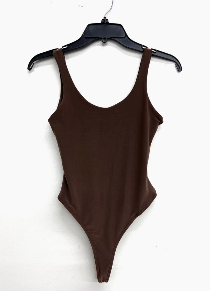 This tank style bodysuit is double lined so, it’s not see through. Great for layering under blazers and jackets. It pairs well with our Autumn Kimono Set. Or with a pair of jeans. A definite wardrobe essential. 92% Polyester, 8% Spandex Fitted Sleeveless Bodysuit For Everyday, Everyday Fitted Sleeveless Bodysuit, Casual Solid Color Bodysuit For Fall, Trendy Solid Tops With Lined Body, Spring Everyday Bodysuit With Scoop Neck, Everyday Spring Bodysuit With Scoop Neck, Spring Scoop Neck Bodysuit For Everyday, Casual Solid Bodysuit For Fall, Stretch Scoop Neck Bodysuit For Everyday