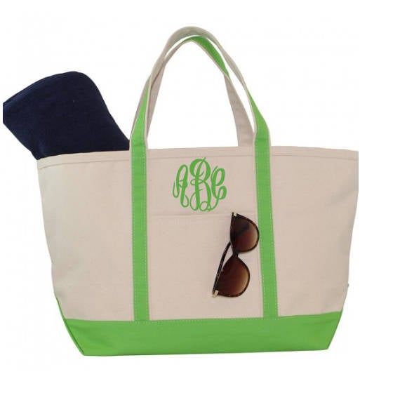 "Our personalized beach tote makes a great vacation beach bag. The classic canvas Boat Tote was designed to be the perfect beach bag and when you add your monogram to this beach bag it makes it even better! This personalized zip top tote is a summer must have! Ideal for toting a lot of stuff for you or your whole family, this bag's roomy interior is sure to make it a fast favorite among trips to the beach, park or really anywhere given it's classic design. Featuring contrasting trim and a top zi Canvas Tote Beach Bag For Vacation, Canvas Beach Tote Bag For Vacation, Personalized Green Travel Bag, Green Canvas Beach Bag For Vacation, Canvas Tote Bag For Beach Season, White Cotton Canvas Bag For Weekend Trips, Canvas Beach Bag With Canvas Lining For Vacation, Vacation Beach Bag With Canvas Lining, Beach Season Canvas Tote Bag