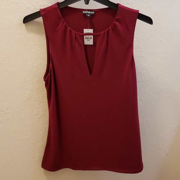 Express Keyhole Tank In Maroon New With Tag Size Medium Pit To Pit: 16.5 Inches Length: 24 Inches Red Sleeveless Blouse For Work, Red Casual Sleeveless Blouse, Casual Red Sleeveless Blouse, Casual Red Sleeveless Top, Elegant Stretch Burgundy Tops, Red Stretch Tops For Work, Red Stretch Top For Workwear, Red Stretch Top For Work, Elegant Burgundy Sleeveless Top