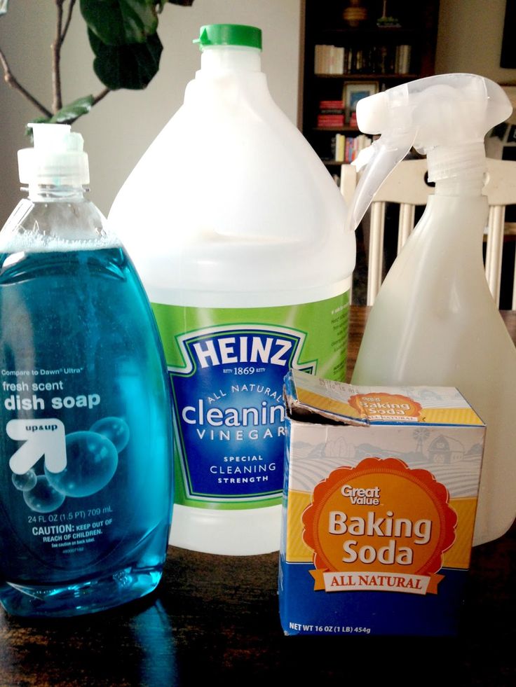 several cleaning products are sitting on a table