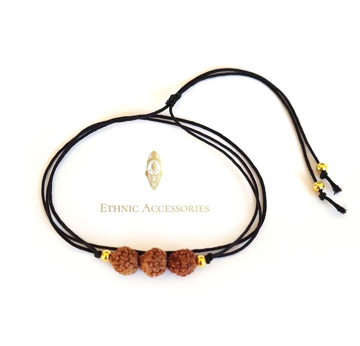 Black cord bracelet with Rudraksha beads. The bracelet can be wrapped around your wrist 3 times and is adjustable with a sliding knot. The mukhi beads have 5 eyes and are 7mm.  Rudraksha means ''The tears of Shiva''. In Hinduism, it is believed that Shiva meditated for the happiness and well-being of the people. The tears he shed touched the earth and crystallized, to form Rudraksha trees (Eleocarpus). The Rudrakshas grow in the fruits of the Eleocarpus tree and can be found in India, Nepal, Mal Adjustable Bracelets For Meditation And Festivals, Adjustable Spiritual Mala For Puja, Adjustable Spiritual Bracelets For Festivals, Adjustable Traditional Bracelets For Rituals, Adjustable Spiritual Jewelry For Puja, Adjustable Spiritual Bracelets For Rituals, Adjustable Hand-strung Jewelry For Puja, Adjustable Spiritual Friendship Bracelets For Festivals, Adjustable Bohemian Bracelets For Puja