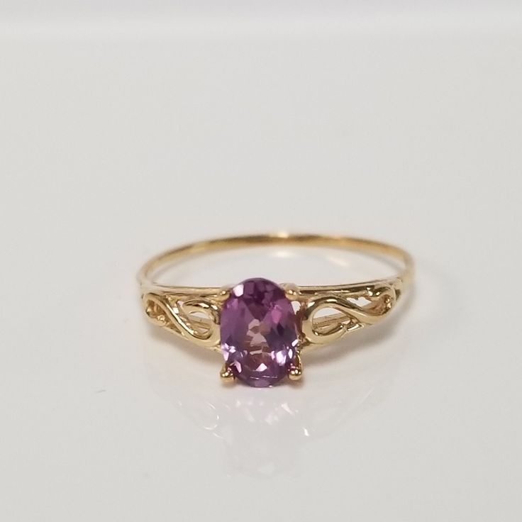 "Thanks for shopping our vintage estate store. We tend to sell well below wholesale and truly hope you enjoy all of our items. Many of the items are one of a kind, so please enjoy scrolling through the pictures and hopefully something will catch your eye. Spots are from reflections or camera. Estate 14k yellow gold created .50ct alexandrite midi or birthstone ring. The color of the gem is blue, green, to purple. No scratches on the gem. Stunning. Bought out a jewelry store that was closing and t Classic Gold Amethyst Birthstone Ring, Classic Gold Amethyst Solitaire Ring, Vintage 14k Gold Amethyst Ring With Accent Stones, Classic Yellow Gold Amethyst Birthstone Ring, Classic Yellow Gold Amethyst Ring, Heirloom 14k Gold Amethyst Ring For Anniversary, Classic Yellow Gold Amethyst Ring As Gift, Classic 14k Gold Amethyst Birthstone Ring, Classic Yellow Gold Amethyst Ring With Prong Setting