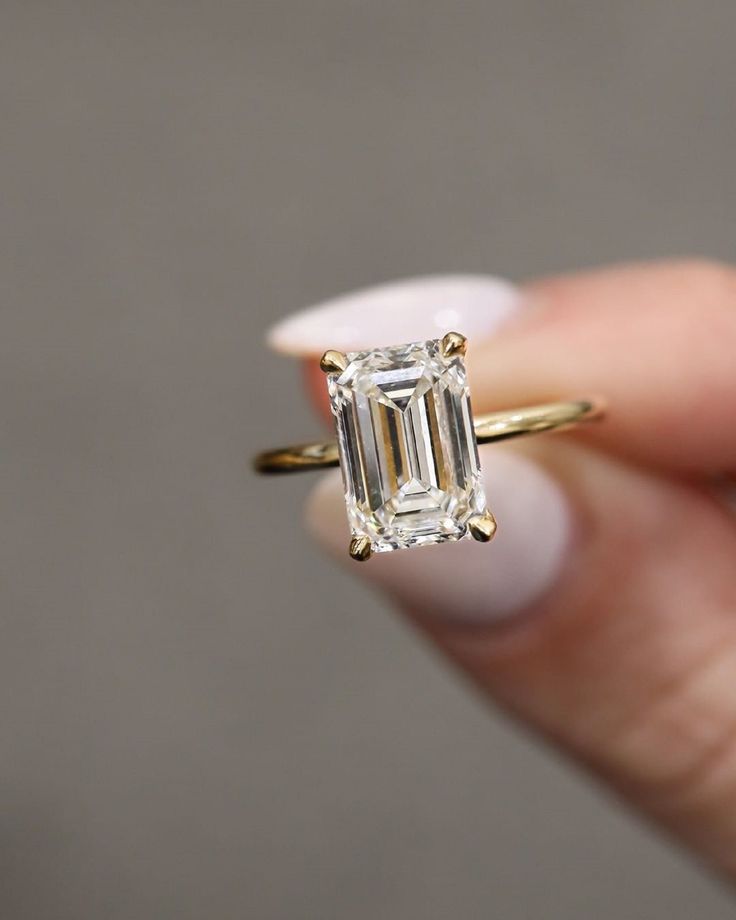 3.15 TC Elongated Emerald Cut Solitaire,Moissanite Wedding Ring,14k Solid Yellow Gold Ring,Handmade Hidden Halo,4 Claw Prongs,Proposal Gifts ❤ ITEM DETAILS:- ✦ Brand: The American Gold House (TAGH) ✦ Handmade, high-quality item! ✦ Material: Solid 10K/14K/18K Gold, 950 Platinum and 925 Sterling Silver ✦ Diamond Type: Moissanite Diamond ✦ Diamond Cut: 12x8 MM Elongated Emerald ✦ Diamond Weight: 3.0 CT ✦ Main Stone Color: Colorless ✦ Width of Band: 1.6 MM (Bottom) ✦ Diamond Clarity: VVS/VS ❤ ACCENT/HALO DIAMONDS:- ✦ Side Stone Material: Moissanite Diamond ✦ Side Stone Shape: Round Cut ✦ Side Stone Carat Weight: 0.15 CT ✦ Side Stone Color: Colorless ✦ Diamond Clarity: VVS/VS ------------------------------------------------------------------------------ 💎 Moissanite VS Diamond 💎 ------------- Classic Rectangular Emerald Wedding Ring, Classic Wedding Emerald Cut Emerald Ring, Solitaire Moissanite Emerald Ring For Wedding, Radiant Cut Solitaire Emerald Ring For Wedding, Radiant Cut Solitaire Emerald Wedding Ring, Timeless Rectangular Emerald Wedding Ring, Rectangular Wedding Ring With Prong Setting, Wedding Moissanite Radiant Cut Emerald Ring, 14k Gold Rectangular Wedding Diamond Ring