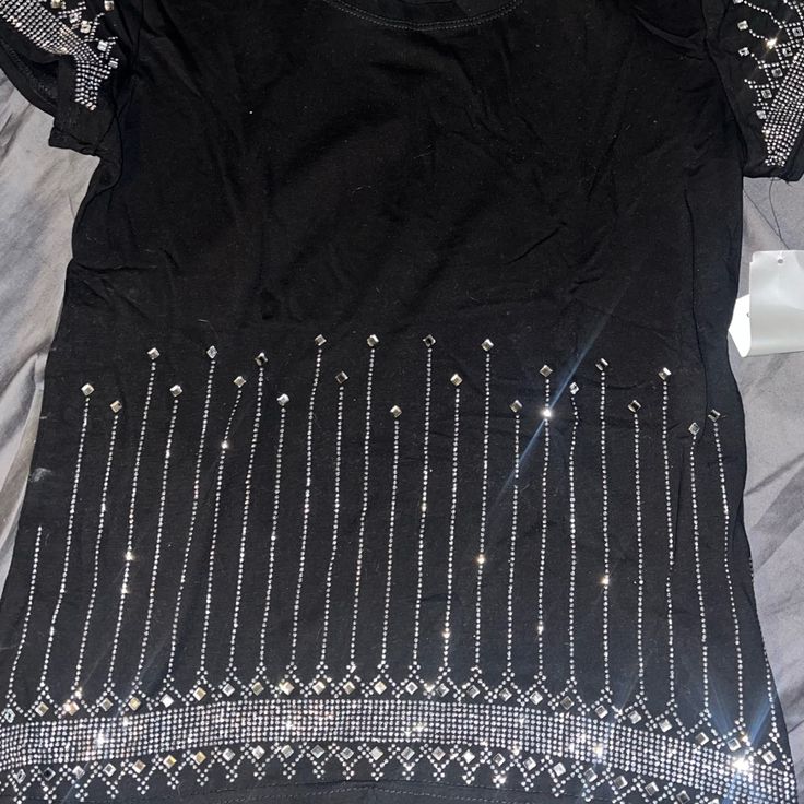 Bedazzle T-Shirt Black Rhinestone T-shirt For Party, Black T-shirt With Rhinestones For Party, Party T-shirt With Rhinestones And Short Sleeves, Short Sleeve Tops With Rhinestones For Night Out, Rhinestone Embellished Short Sleeve T-shirt For Night Out, Fitted Rhinestone T-shirt For Party, Black Graphic Tee For Party, Black Graphic Tee For Night Out, Casual Party Tops With Rhinestones