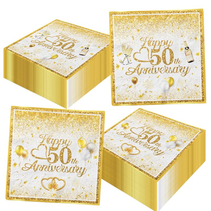 three gold and white boxes with happy 50th anniversary written on the front, two are filled with confetti