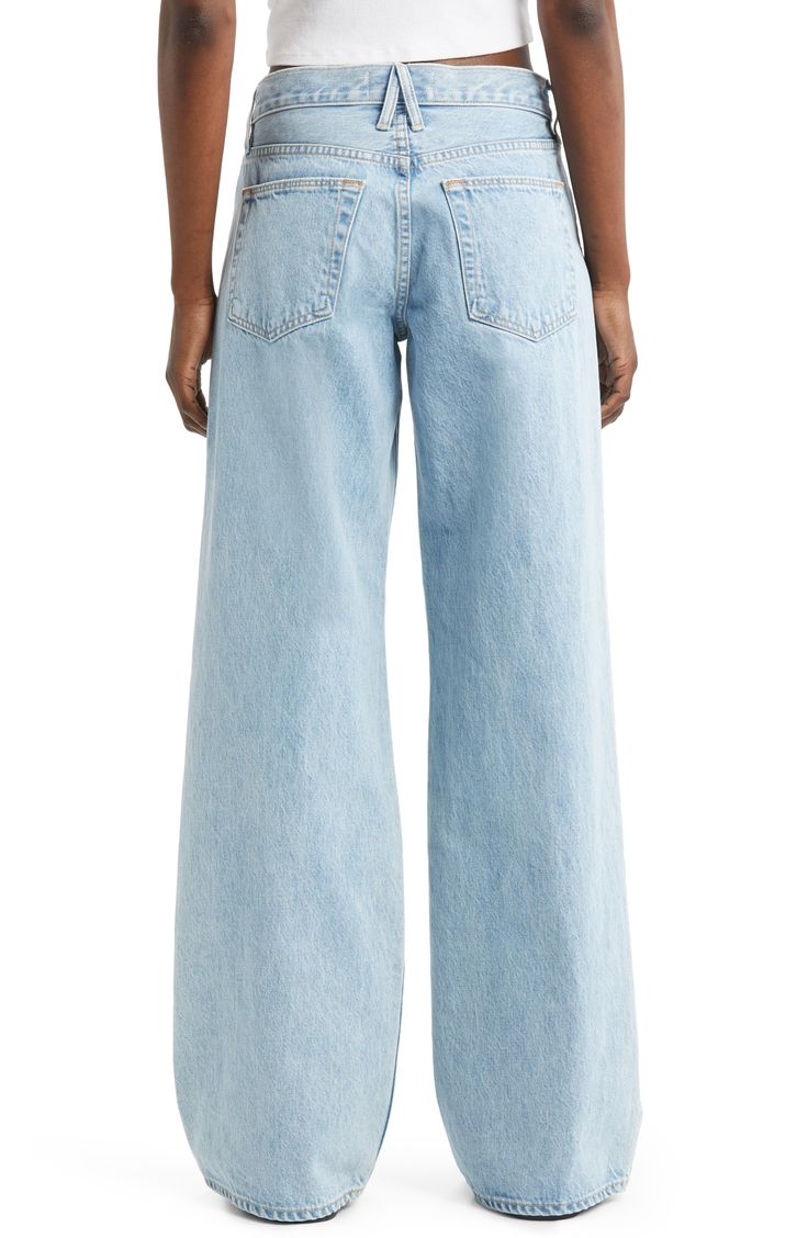 Relaxed yet dramatic, these light-wash jeans are handcrafted from nonstretch Italian denim in Los Angeles with a slouchy waist and full-length wide legs. 33" inseam; 25" leg opening; 12 1/2" front rise; 16 1/2" back rise (size 29) 100% cotton Machine wash, tumble dry Made in the USA of imported fabric Spring Relaxed Fit Flare Jeans In Recycled Denim, Spring Light Wash Rigid Denim Jeans, Light Wash Relaxed Fit Jeans In Recycled Denim, Light Wash Relaxed Fit Bottoms In Recycled Denim, Light Wash Relaxed Fit Recycled Denim Bottoms, Relaxed Fit Light Wash Recycled Denim Bottoms, Light Wash Relaxed Fit Recycled Denim Jeans, Chic Light Wash Rigid Denim Flare Jeans, Chic Light Wash Relaxed Fit Cropped Jeans