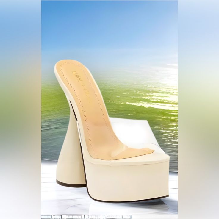 Chase & Chloe’s “Miranda” Is A Sculpted Stiletto Heel Featuring A Wide Base For Stability To A Platform Sandal With A Clear Strap For A Floating Effect. Heel Height: 4.75in With 2.5in Platform. Synthetic Upper, Lining & Sole Imported. Color: White & Clear. White Wedge Sandals With Sculpted Heel, White Wedge Heel Sandals With Sculpted Design, White Wedge Heel Sandals With Sculpted Heel, Summer High Heel Mules With Sculpted Heel, Summer Mules With Sculpted High Heel, Summer Heels With Sculpted Heel And Round Toe, Summer Round Toe Heels With Sculpted Heel, Summer Sculpted High Heel Mules, Summer Sculpted Heel With Round Toe