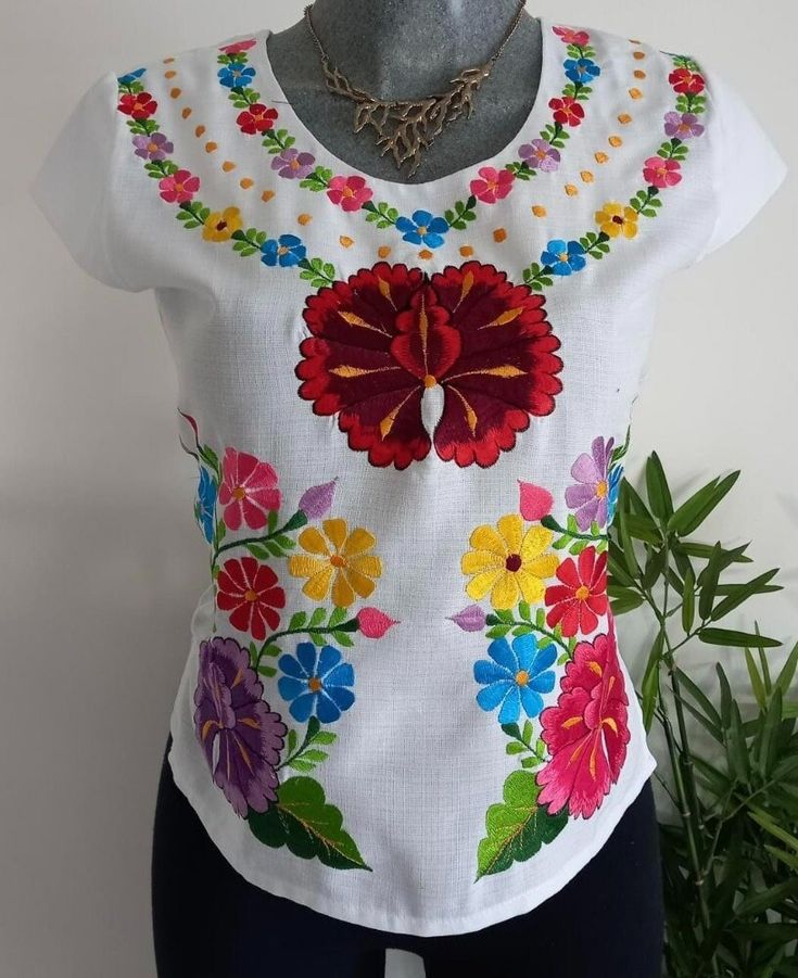 Hand crafted beautiful white Mexican embroidered blouse Fitted White Tops With Machine Embroidery, White Fitted Top With Machine Embroidery, Fitted White Top With Machine Embroidery, White Crew Neck Blouse With Floral Embroidery, White Machine Embroidered Blouse For Spring, White Embroidered Crew Neck Blouse, White Machine Embroidered Tops For Spring, White Tops With Machine Embroidery For Spring, White Embroidered Blouse For Spring