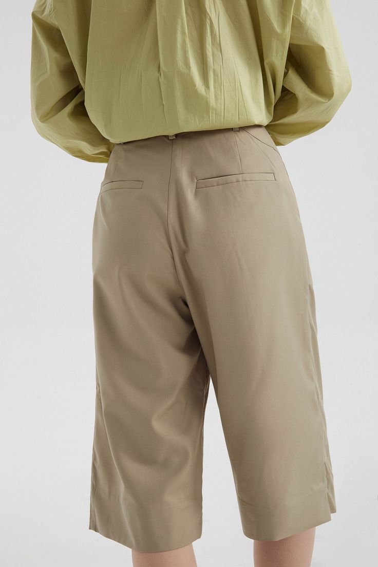 These wide leg carpris pants drape and move with your legs. Crop pants are ideal for summer, adding a lively touch for work and everyday errands. Style #: WWSH901 Spring Workwear Parachute Pants With Elastic Waistband, Spring Parachute Pants With Elastic Waistband For Work, Versatile Wide Leg Pants With Pockets For Spring, Wide-leg Cotton Capris For Work, Summer Wide Leg Chinos With Pockets, Spring Relaxed Fit Ankle-length Culottes, Solid High-waisted Parachute Pants For Work, Solid Color Wide-leg Parachute Pants For Summer, Solid Wide-leg Parachute Pants For Summer