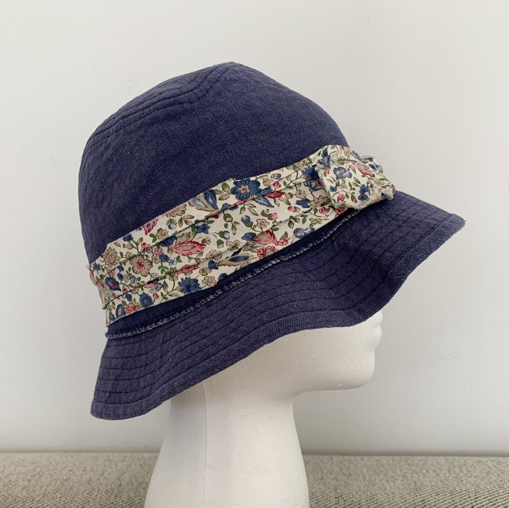 Nautica Girl’s Denim Bucket Hat - Blue Floral- One Size- suggesting fitting 6-9T. Garment manufacturer label removed. Dry-cleaned. In very good preloved condition. Blue Cotton Wide Brim Hat, Blue Denim Bucket Hat With Short Brim, Navy Cotton Brimmed Hat, Summer Denim Blue Cotton Hat, Blue Denim Bucket Hat For Summer, Blue Denim Sun Hat With Curved Brim, Denim Blue Summer Hat, One Size Fits Most, Denim Blue Summer Hat One Size, Denim Blue Cotton Hat For Beach