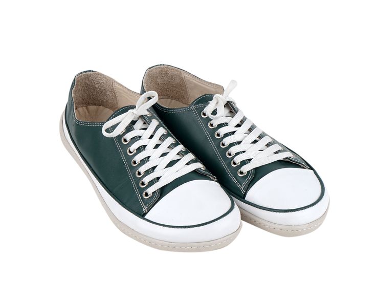 a pair of green and white tennis shoes