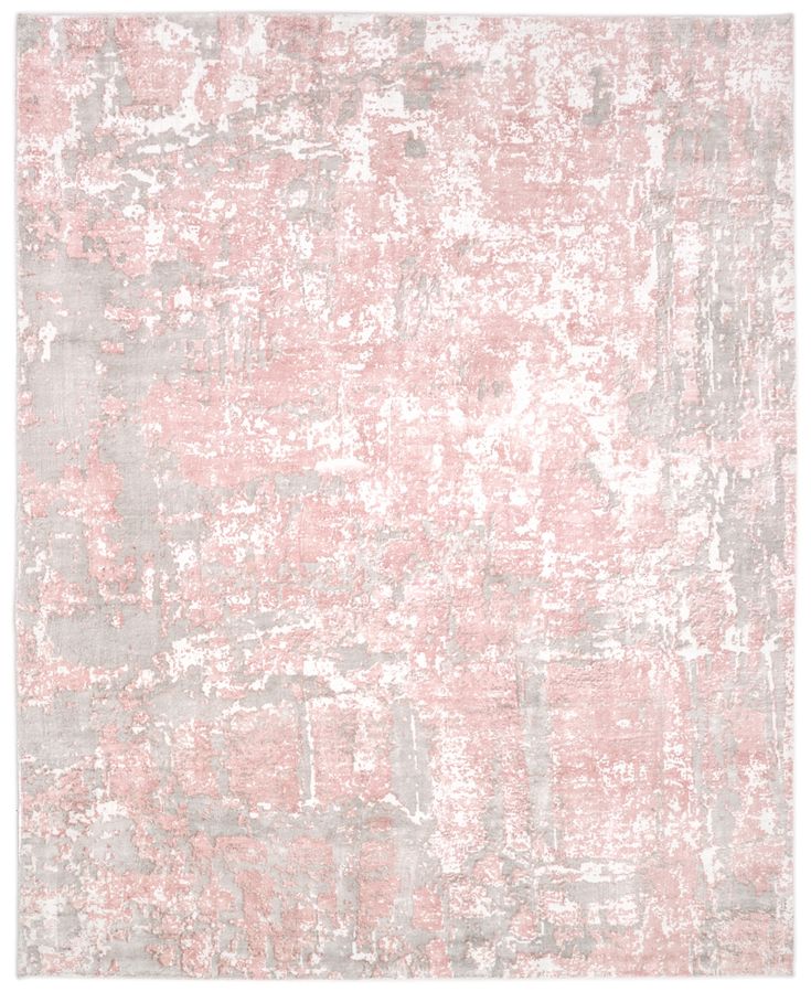 an area rug with pink and grey colors on the ground, in front of a white background