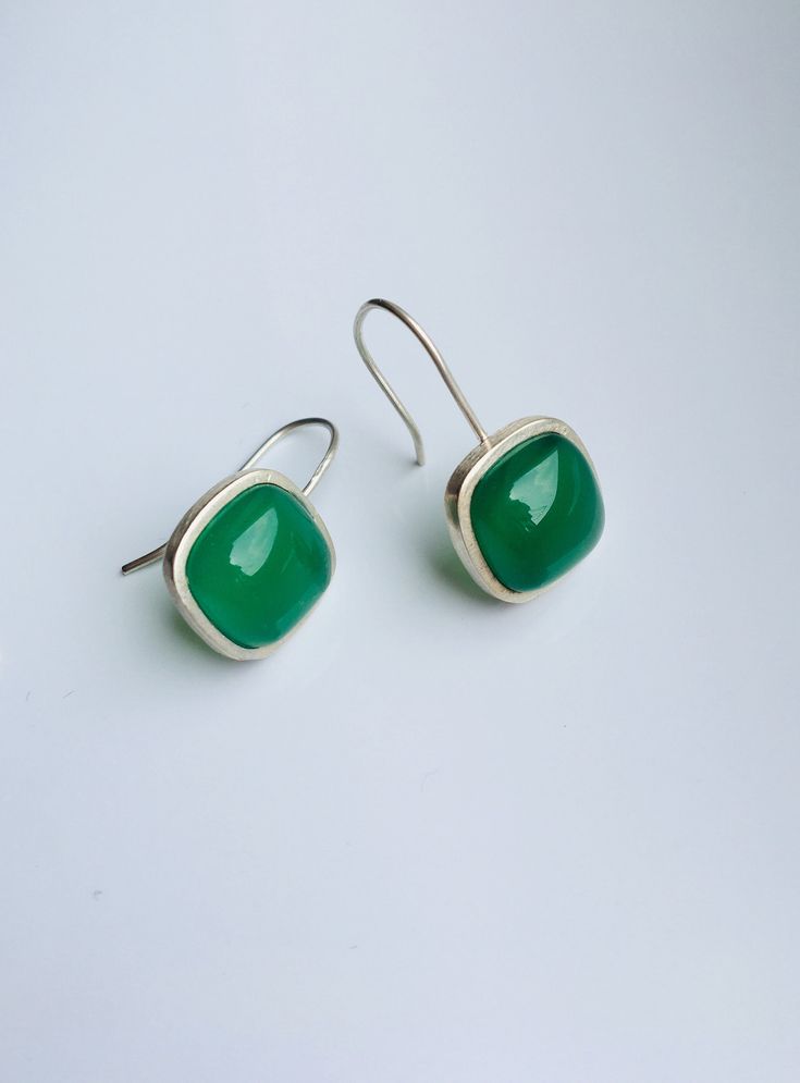 Lovely green jade cube earrings with sterling silver ear wire. They are made from high-quality jades and sterling silver. Simple and minimalistic design works great for all sort of occasion: dating, daily-wear, home or office, you name it. Perfect as a gift for your loved ones or yourself. Highlights: ♥ High-quality materials only Hanging quality dark green jade cubes, paired with 925 sterling silver ring. Ensure long last wear and great for sensitive skins. ♥ Simple and minimalistic design Grea Green Formal Earrings With Ear Wire, Green Fine Jewelry Drop Earrings, Fine Jewelry Green Drop Earrings, Classic Green Earrings With Ear Wire, Classic Green Drop Earrings, Elegant Green Rectangular Earrings, Elegant Rectangular Emerald Earrings For May Birthstone, Elegant Rectangular May Birthstone Earrings, Silver Rectangular Earrings Fine Jewelry