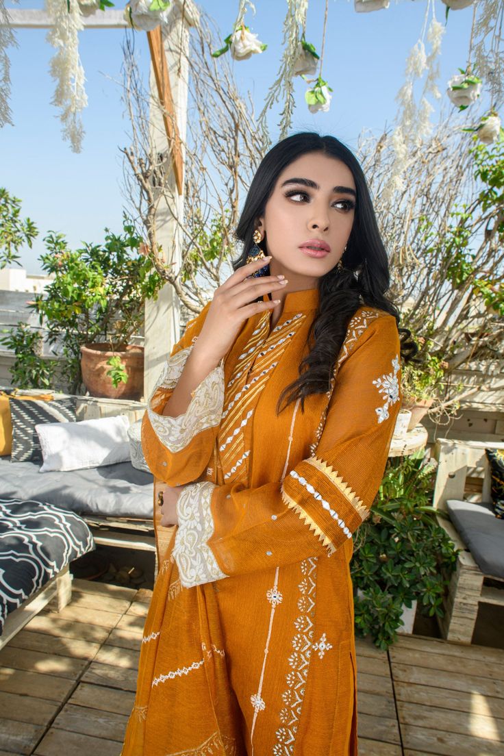 SKU: 1303 Price for Shirt, lining and Pant Pure cotton net with hand block print accentuated with laces and emrboidery of mirror work. The neckline has mirror work with gotta finishings adorned with the laces and and gold and white block print. The hand block print dupatta can be purchased separately. Eid Cambric Sets With Mirror Work, Cotton Silk Lawn Suit With Mirror Work, Designer Cotton Palazzo Set With Dabka Work, Traditional Cambric Sets With Mirror Work, Cotton Sets With Mirror Work For Eid, Cambric Dupatta With Mirror Work, Cambric Kurta With Mirror Work, Festive Traditional Wear With Mirror Work In Cambric, Festive Cambric Kurta With Mirror Work