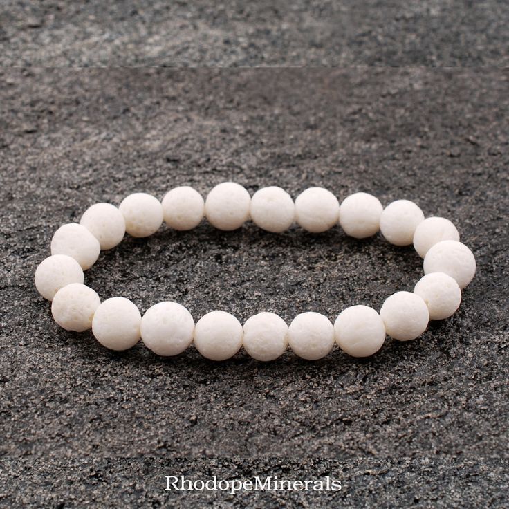 This is a white coral bracelet made of 8 mm beads. Our beads of white coral are so amazing! Incredible pure white. This gorgeous is an irreplaceable spring-summer accessory. CORAL represents diplomacy and concurrence.  It quiets the emotions and brings peace to within the self.  Facilitates intuition, imagination, and visualization.  Coral expedites and accelerates the transfer of knowledge. Coral strengthens the circulatory system and the bones of the body.  It stimulates tissue regeneration an White Crystal Bracelet With 8mm Beads, White Crystal Bracelet With 8mm Round Beads, White Pearl Bracelet With Gemstone Beads, White Pearl Bracelet With 8mm Round Beads, White Crystal Bracelet With Round Beads For Meditation, White Crystal Bracelet With Round Natural Stones, Minimalist White Jewelry With 8mm Beads, White Spiritual Pearl Bracelet With Gemstone Beads, Spiritual White Pearl Bracelet With Gemstone Beads