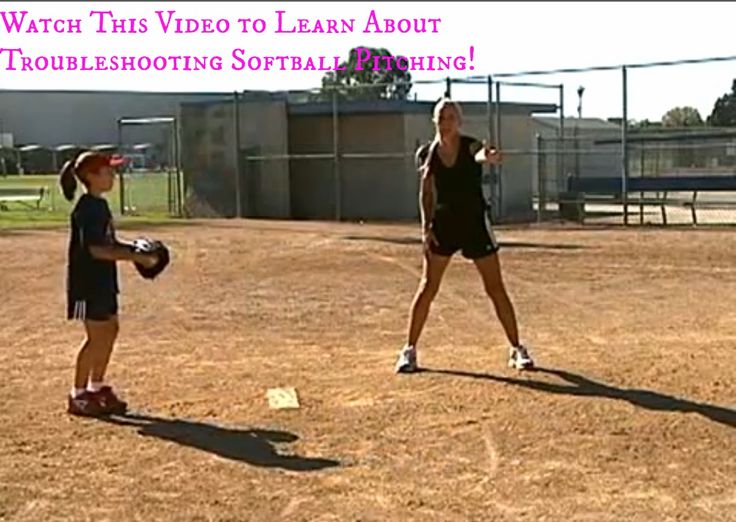 two girls are playing softball on the field