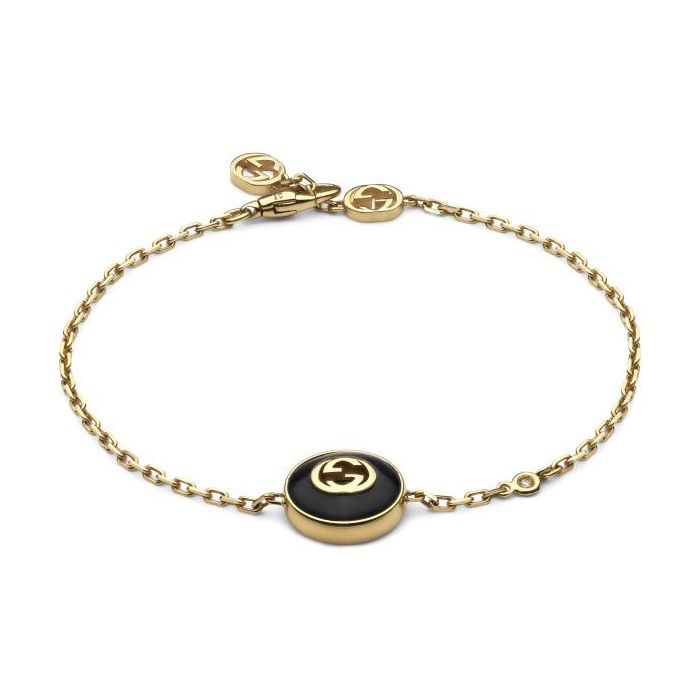 From Gucci, the Interlocking G logo appears in elegant new interpretations for Pre-Fall 2024. Precious black onyx stone is paired with yellow 18k gold and embellished with a sparkling diamond. This chain bracelet can be matched with other accessories from the same line. 18k yellow gold and black onyx stone Chain with Interlocking G detail Interlocking G charm 0.5" 1 white diamond, approximately 0.008 carats Clasp closure with Interlocking G Gucci Style #: YBA786556001017 Luxury Modern Gucci Bracelets, Luxury Gold-tone Jewelry With Logo Charm, Formal Yellow Gold Bracelets With Gold-tone Logo, Luxury Gold-tone Bracelet With Logo Charm, Elegant Gold-tone Jewelry With Logo Charm, Designer Yellow Gold Bracelets With Gold-tone Hardware, Designer Yellow Gold Jewelry With Gold-tone Hardware, Gold-tone Formal Bracelets With Logo Charm, Luxury Gold Jewelry With Gold-tone Logo Plaque