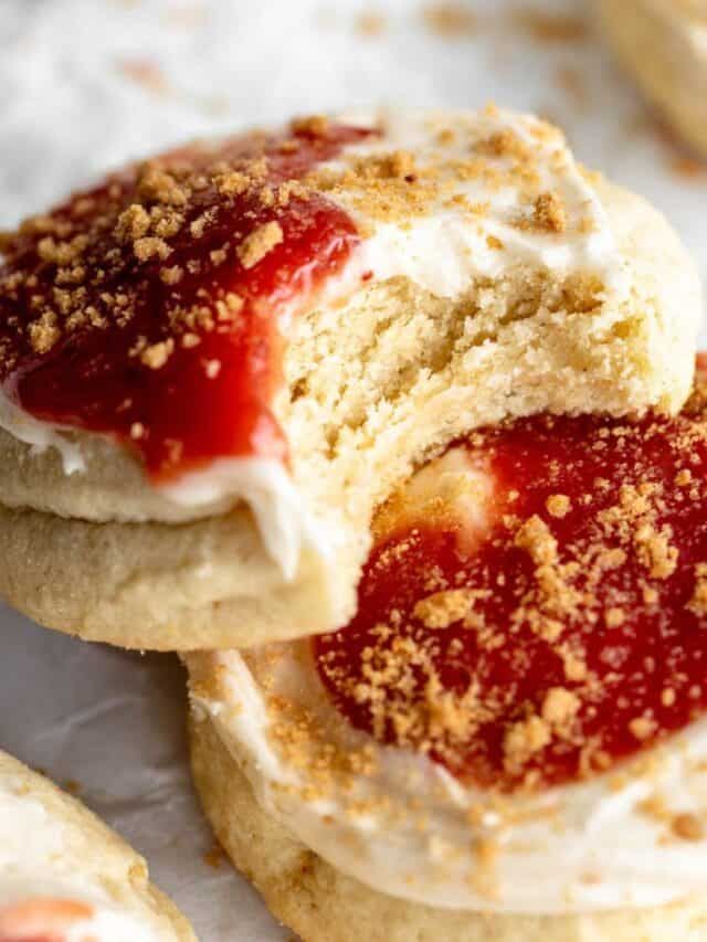 strawberry shortcakes with whipped cream and crumbled sugar on top are shown