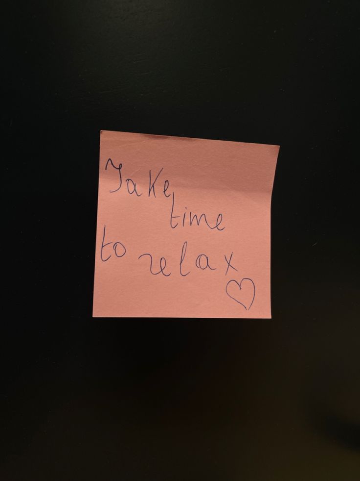 a sticky note attached to a refrigerator door with the words take time to relax written on it