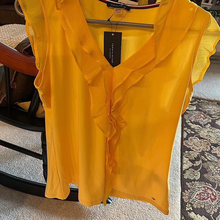 Ladies Bright Yellow Top. Size Large. 95% Polyester And 5% Spandex. No Wrinkles. Perfect For Work Or Travel! Pet Free Home And Smoke Free Home. This Will Make You Tan Pop!! Yellow Stretch V-neck Blouse, Spring Stretch Top By Tommy Hilfiger, Tommy Hilfiger Stretch Top For Spring, Spring Tommy Hilfiger Stretch Top, Tommy Hilfiger Stretch Tops For Summer, Tommy Hilfiger Spring Blouse For Work, Tommy Hilfiger Blouse For Spring Workwear, Tommy Hilfiger Spring Workwear Blouse, Tommy Hilfiger Short Sleeve Tops For Work