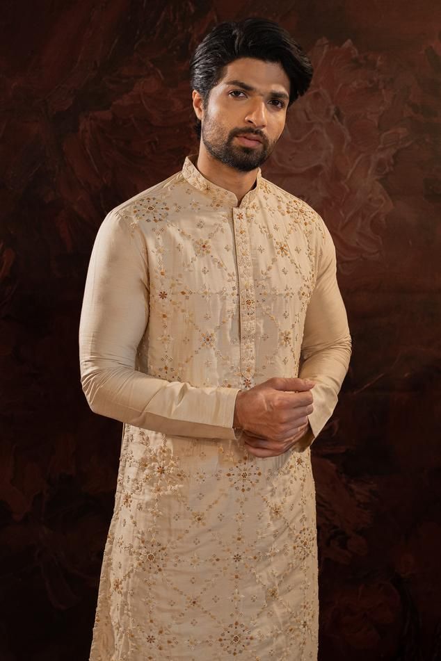 Beige silk kurta with all over hand done french knot embroidery with mustard and maroon highlights. Comes along with churidar.
Components: 2
Pattern: Embroidery
Type Of Work: French Knots
Neckline: Stand Collar
Sleeve Type: Full Sleeves
Fabric: Silk
Color: Beige
Other Details: 
Concealed button placket
Occasion: Sangeet - Aza Fashions Menswear Kurta, Maroon Highlights, Knot Embroidery, French Knot Embroidery, Beige Silk, Silk Kurta, French Knots, French Knot, Pattern Embroidery