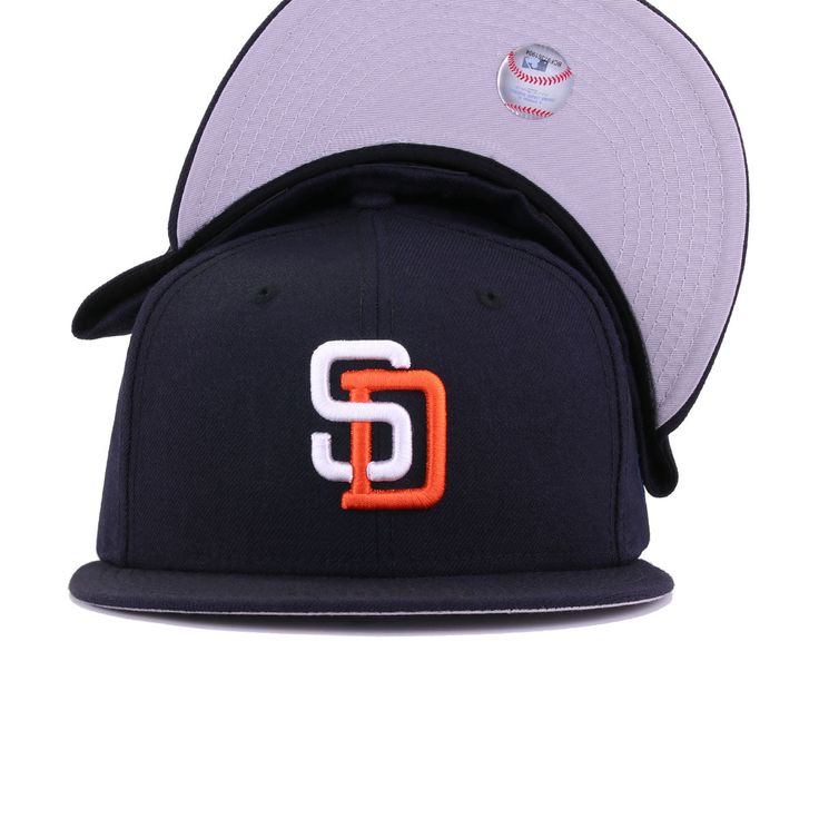 New Era Cap 59Fifty fitted hat for the San Diego Padres in navy blue and orange colorway, featuring interlocking SD logo on the front. This 90s throwback is all business. Officially colored with clean lines all throughout, this fitted is proof that simplicity goes a long way. Grab yours today! Hat Material: 100% WoolCrown: NavyVisor: NavyButton: NavyUndervisor: GreyFront Logo: Snow White/OrangeadeNew Era Flag: Midnight NavyRear Logo: Midnight Navy/Snow White/Orangeade Sd Logo, 90s Throwback, World Baseball Classic, San Diego Chargers, San Antonio Spurs, New Era Cap, San Diego Padres, New Era 59fifty, Oakland Athletics