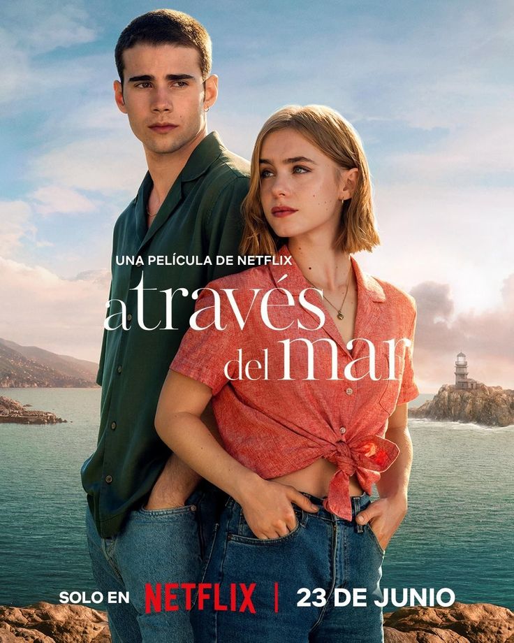 a man and woman standing next to each other in front of the ocean on a movie poster