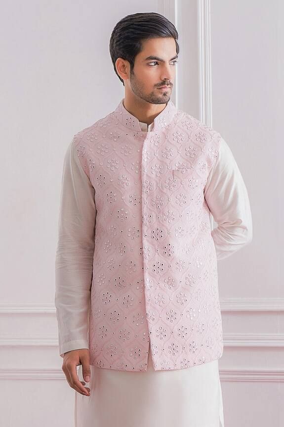 Powder pink Nehru jacket in pure georgette base fabric featuring machine and mirror embroidered motifs.
Component: 1
Pattern: Embroidered
Type Of Work: Mirror Work
Neckline: Mandarin
Sleeve Type: Sleeveless
Fabric: Pure Georgette; Lining: Twill Satin
Color: Pink
Other Details: 
Front button down jacket
Pocketed jacket
Note: The kurta and churidar worn by the model is not for sale
Occasion: Wedding - Aza Fashions Nehru Jacket For Men, Sleeveless Kurta, Mirror Embroidery, Nehru Jacket, Pink Mirror, Nehru Jackets, Satin Color, Mirror Work, Churidar