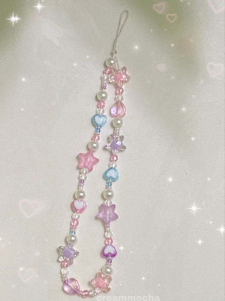 pink, purple, blue cute phone charm Phone Charms Pastel, Trendy Phone Charms, Phone Chain Aesthetic, Aesthetic Phone Chain, Charms Phone Case, Pastel Phone Charm, Phone Carm Aesthetic, Phone Chain Beads Aesthetic, Phone Charms Aesthetic Purple