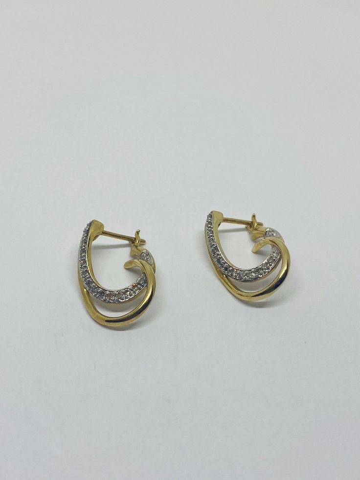 "This is a classic, vintage pair of 10K yellow gold, 10K white gold, and diamond loop-design dangle/drop earrings. Material(s): 10K yellow gold + 10K white gold + several small diamonds Total weight: 3.4 grams Flaws (if any): None to mention Marking(s): \"10K\" If you have any questions about this pair of earrings, please do not hesitate to contact us! ♥" Classic Hallmarked Yellow Gold Diamond Earrings, Classic Gold Diamond Earrings Hallmarked, Classic Gold Hallmarked Diamond Earrings, Classic 14k Gold Diamond Earrings, Hallmarked, Hallmarked Yellow Gold Diamond Earrings, Hallmarked Teardrop Diamond Earrings, Hallmarked Pear-shaped White Gold Diamond Earrings, Yellow Gold Drop Hoop Earrings For Anniversary, Formal 14k Stamped Diamond Earrings