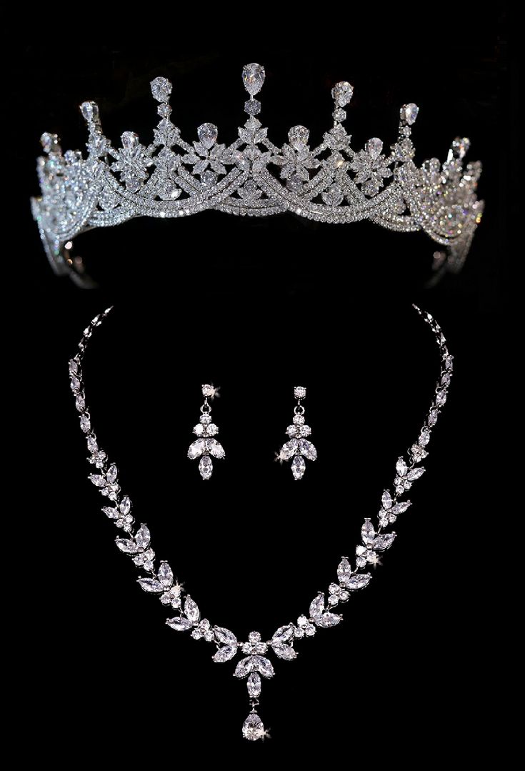 a tiara and earrings are shown on a black background