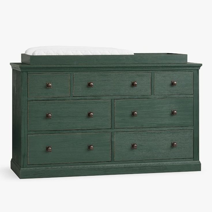 a green dresser with six drawers and a white mattress