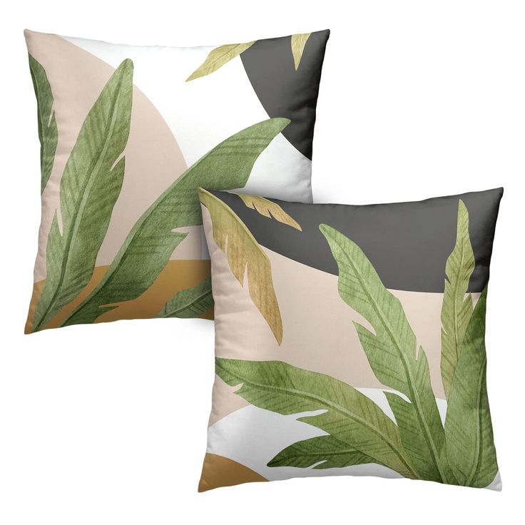 two pillows with green leaves on them, one in grey and the other in gold