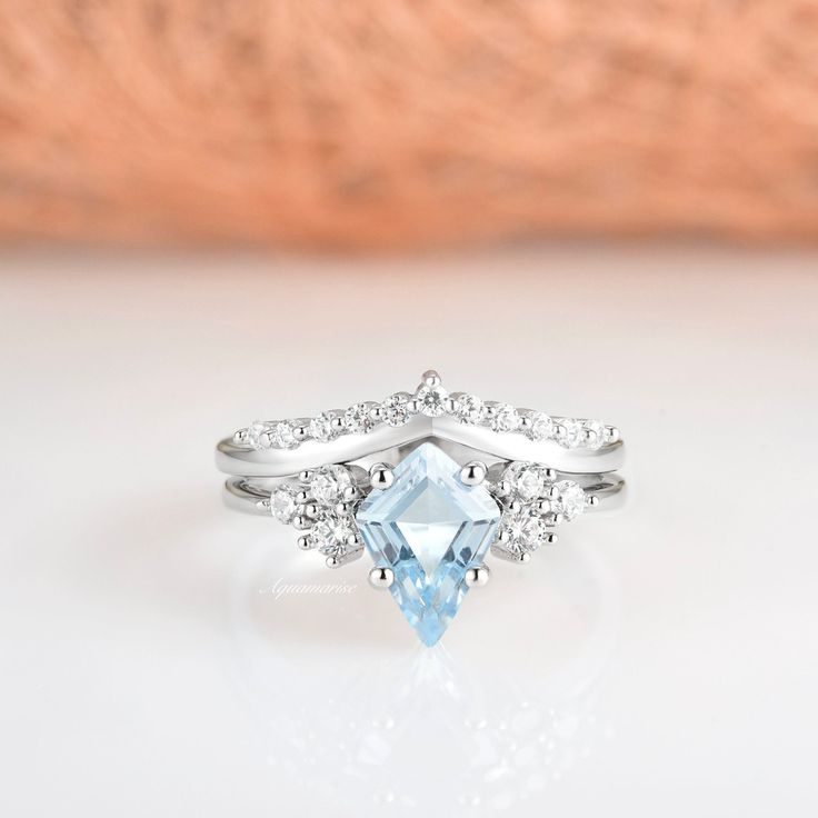 Gorgeous Kite Cut Aquamarine Ring Set ►Made of 925 solid sterling silver with a rhodium finish ►Accented with simulated diamonds (CZ) ►Average band width: 1.8-2 mm ►Sold as a set Center Stone: Aquamarine Color: Blue Shape: Kite Gem size: 6.0 x 10.0 mm Carat Weight: 1.4 ct. (approx.) Gemstone creation: Lab-created Hardness: 8 ✓ 100% Nickel-Free ✓ Comfort Fit ✓ Free Ring Box ✓ Free USA Shipping ✓ Ready to ship next business day *All listing photos and ring design are subject to copyright. *All rig Aquamarine Color, Aquamarine Colour, Blue Themed Wedding, Aquamarine Engagement Ring, Engagement Rings Opal, Aquamarine Jewelry, Bridal Ring Sets, Aquamarine Ring, March Birthstone