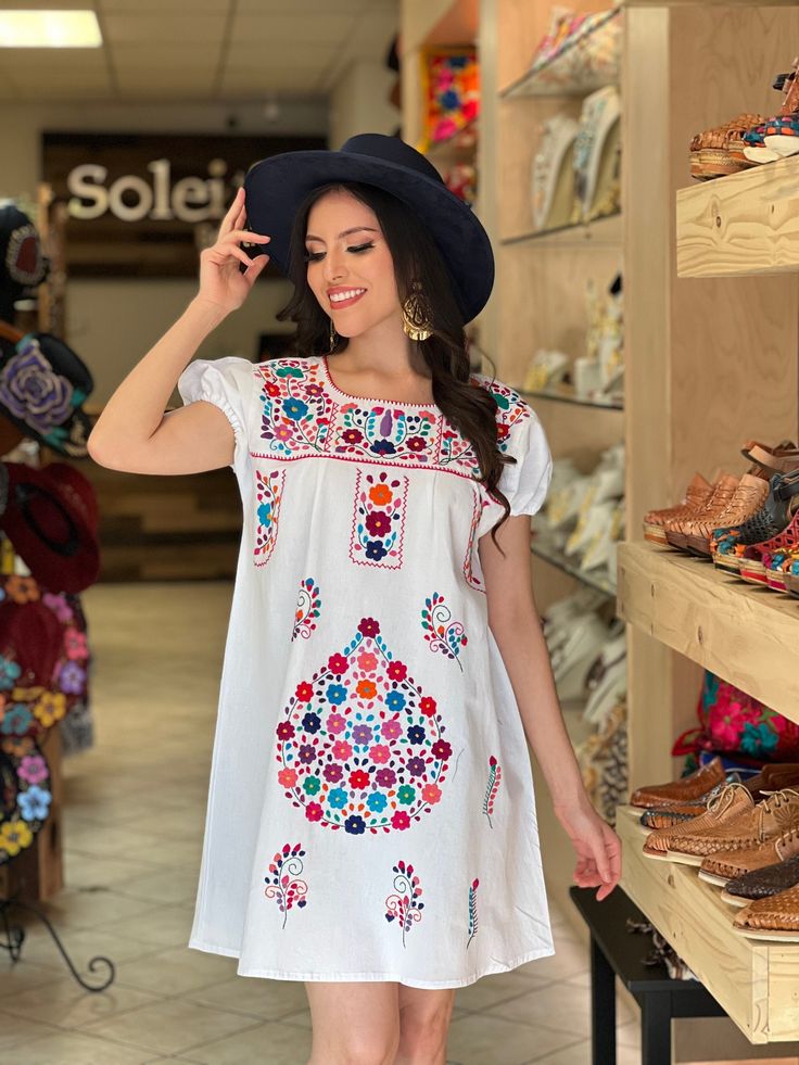 -This Beautiful Floral hand embroidered Dress is the perfect dress to add to your wardrobe. -Its cute enough to dress up for a party or even just wear it to a picnic. -It's lightweight, handmade and hand embroidered by Mexican Artisans in Puebla, Mexico. Summer Embroidered Multicolor Dress, Summer Embroidered Dress With Multicolor Embroidery, Multicolor Embroidered Dress With Short Sleeves, Bohemian Summer Dress With Machine Embroidery, Multicolor Summer Dresses With Machine Embroidery, Bohemian Dress With Multicolor Embroidery, Peasant Dress With Multicolor Embroidery, Peasant Style Dress With Multicolor Embroidery, Traditional Floral Embroidered Short Sleeve Dress